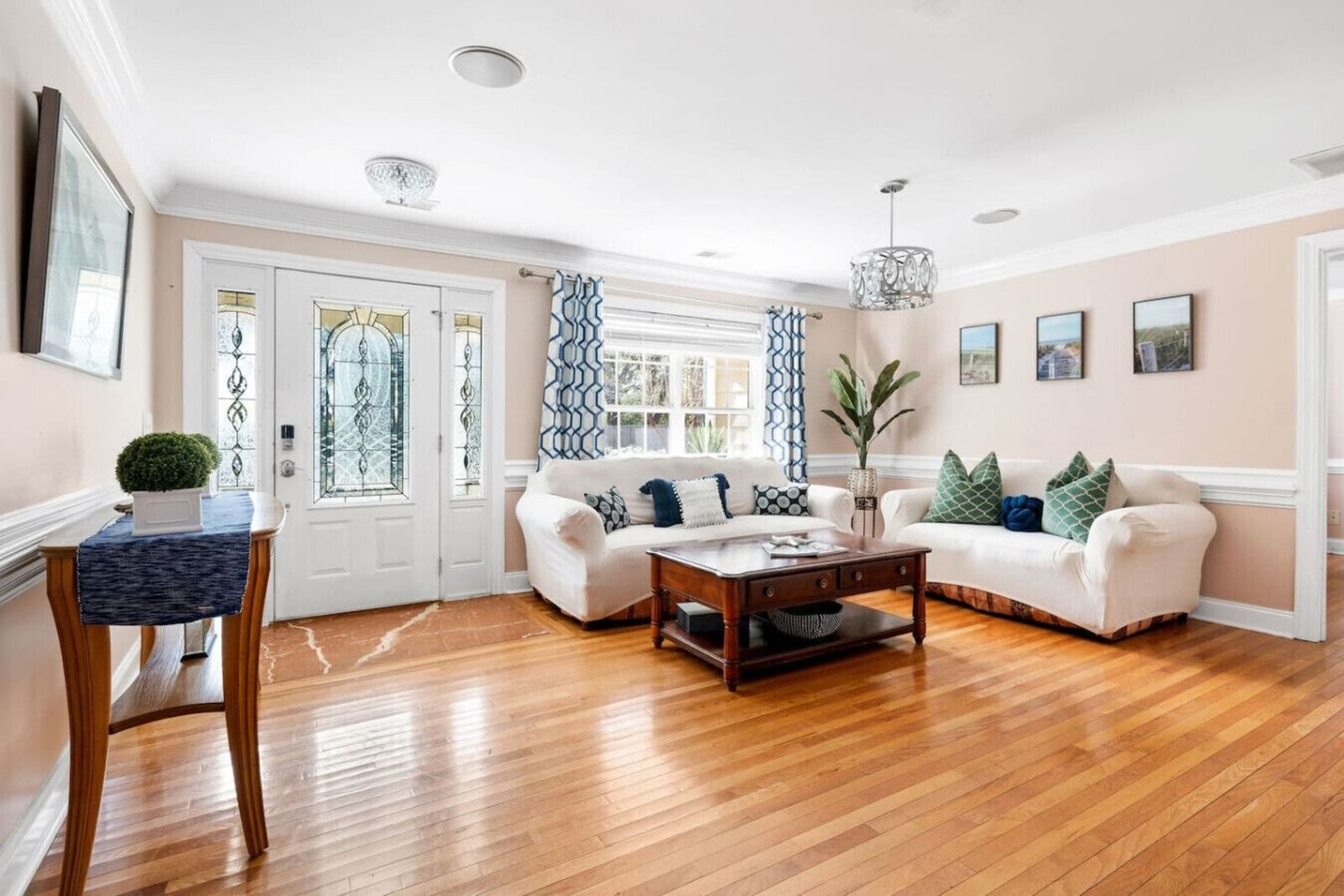 Open living room with hardwood floors and family seating
